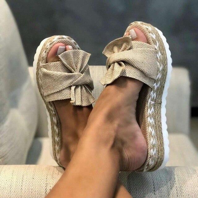 Qosella | Sandalen mit geflochtener Sohle und großer Schleife